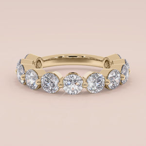 Elegant 14K Yellow Gold Diamond Eternity Band with 7 Round Cut Diamonds, perfect for weddings and special occasions. 