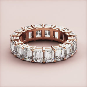 Elegant oval diamond solitaire engagement ring in 14K or 18K rose gold, featuring a hidden halo and plain band.