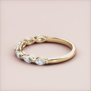 Elegant 14K/18K gold wedding band featuring marquise-cut diamonds in a stunning eternity design, perfect for special occasions. 