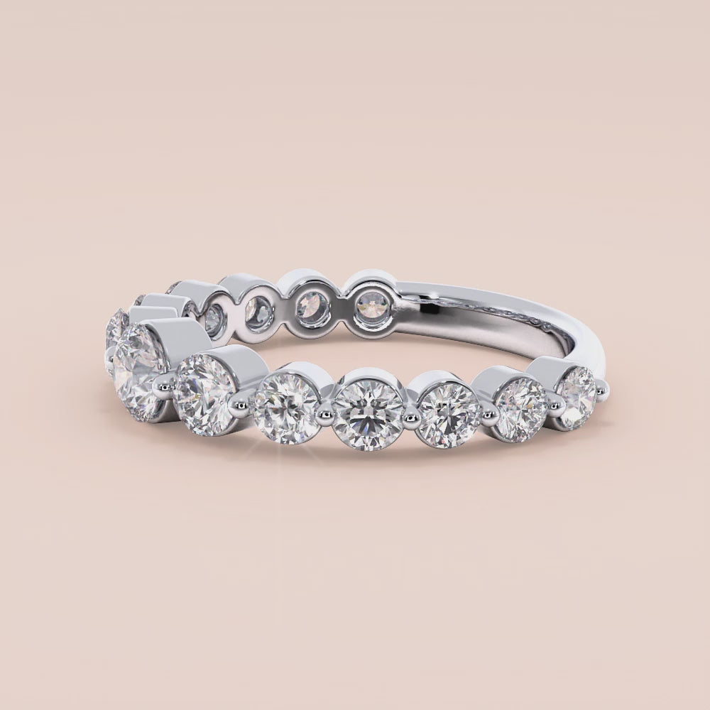 Elegant round diamond eternity wedding band in 14K or 18K white gold, featuring a stunning row of sparkling round-cut diamonds. |
 #14KRecycledWhiteGold
 #18KRecycledWhiteGold
 
 
 
 
 #Platinum