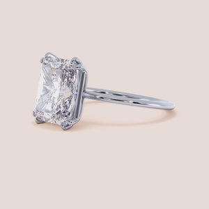 Radiant cut diamond engagement ring in 14K, 18K, or platinum, beautifully showcased for a stunning and elegant choice. 