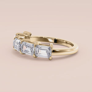 14K/18K gold wedding band featuring five emerald cut diamonds in a shared prong setting for a timeless look. 
