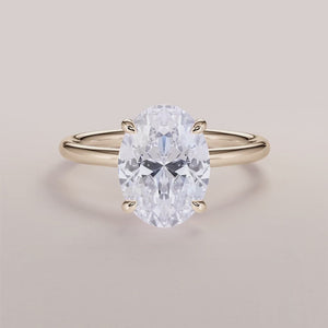 Elegant 14K or 18K gold solitaire engagement ring featuring a radiant cushion-shaped diamond in a classic prong setting.