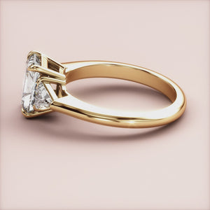 """14K Yellow Gold Mira Radiant Three-Stone Triangle Engagement Ring with exquisite design, perfect for timeless elegance.""