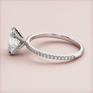 Elegant engagement ring in 14K or 18K white gold, featuring a shield-shaped diamond andPave accents on a knife-edge band.