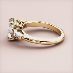 "14K Yellow Gold Lyra Radiant Three-Stone Tapered Baguette Engagement Ring, a stunning symbol of love and elegance.