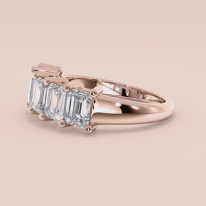 Elegant 14K rose gold five-stone emerald-cut diamond wedding band, showcasing timeless beauty and sophistication. 