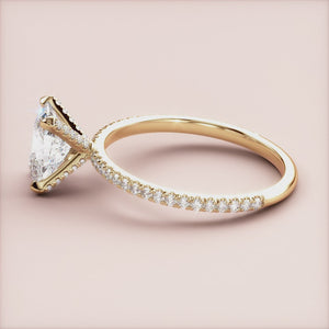 Elegant 14K yellow gold engagement ring with oval solitaire andPave accents, showcasing brilliant diamonds and intricate details.