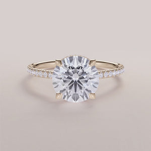 Elegant yellow gold 14K or 18K engagement ring with hidden halo andPave band, featuring a stunning round diamond.
