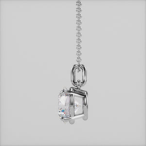 A close-up of a solitaire round-cut diamond pendant in a classic four-prong white gold setting. The pendant’s design ensures maximum brilliance and elegance.
