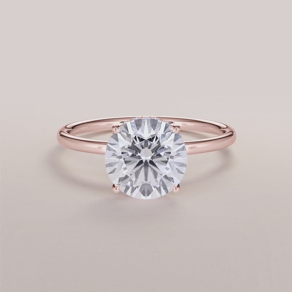 "14K Rose Gold Saros Round Wrapped Hidden Halo Engagement Ring with Plain Band, elegant and timeless design for a perfect proposal.|







#14KRecycledRoseGold
#18KRecycledRoseGold


"
