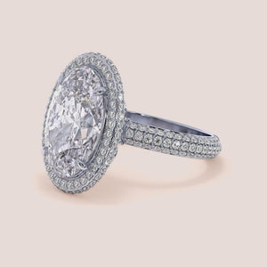 "Oval double edge halo engagement ring in 14K white gold, featuring luxurious 3D pave detailing for an elegant sparkle.