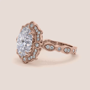 Detailed video showcasing oval halo vintage-inspired diamond ring set with exquisite filigree in recycled rose gold 