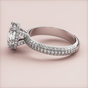 Elegant 14K white gold engagement ring featuring an oval diamond with hidden halo accents andPave diamonds, showcasing timeless beauty.