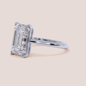 "Elegant 14K white gold emerald solitaire cathedral engagement ring, showcasing timeless beauty and brilliance for your perfect proposal.