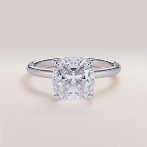 "Elegant 14K white gold engagement ring featuring an Oberon cushion cut with an invisible gallery and hidden halo, plain band design.