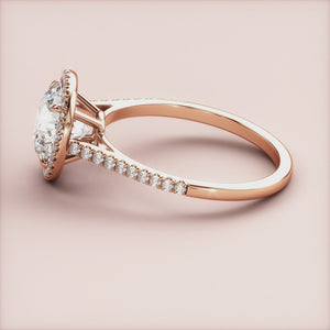 Stunning 14K rose gold engagement ring with a halo of diamonds andPave band, elegantly designed without a model.