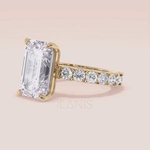 Yellow gold emerald cut diamond engagement ring on hand with eternity band, modern bridal look, elegant proposal ring inspiration 
