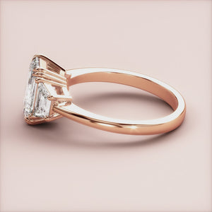 "Rose gold 14K emerald three stone trapezoid engagement ring, elegant and unique design for a timeless love.