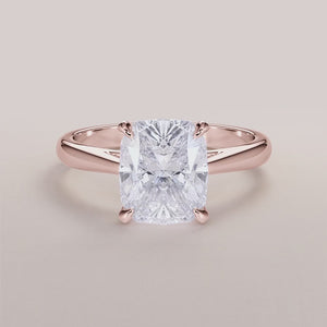 Elegant 14K rose gold engagement ring featuring a brilliant cushion diamond in a classic solitaire cathedral setting.