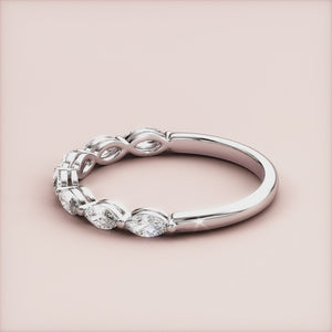 Elegant marquise half eternity wedding band featuring diamonds in a 14K or 18K white gold band, perfect for timeless elegance. 