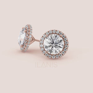 Close-up video of signature round halo diamond stud earrings in rose gold, capturing light reflection, halo sparkle and fine setting details in motion 