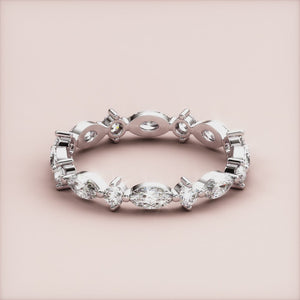 Stunning 14K/18K gold or platinum eternity ring with marquise diamonds, perfect for weddings and elegant occasions. 