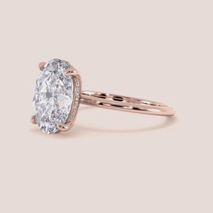 Elegant oval diamond ring in 14K, 18K, or platinum, showcasing a stunning solitaire design for timeless engagement beauty.
