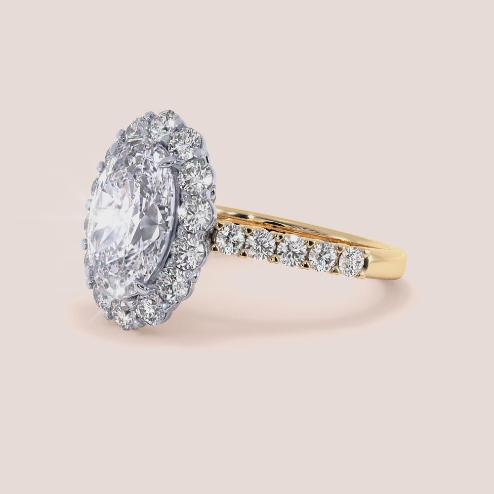 Two-tone 18K oval diamond engagement ring with halo and pave band in yellow and white gold, showcasing exquisite craftsmanship. |
#14KRecycledYellow/WhiteGold
#18KRecycledYellow/WhiteGold 