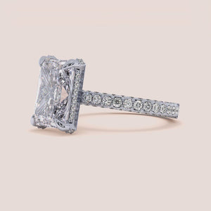 "14K white gold Leona radiant hidden halo ring with 3D pave design, perfect for elegant engagement moments.