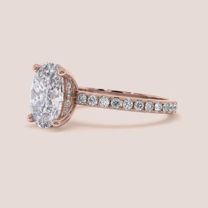 Elegant engagement ring with emerald-cut diamond, available in 14K or 18K gold, or platinum, featuring exquisite side diamonds.
