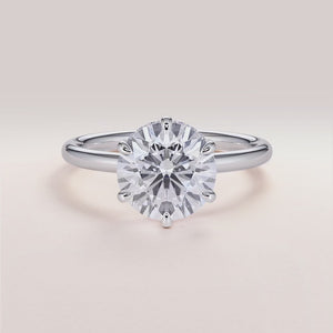 "Elegant 14K white gold Vulcan round engagement ring with invisible gallery and hidden halo, ideal for timeless love.