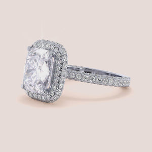 Radiant cut diamond engagement ring in 14K or 18K white gold or platinum with Pave diamond band, front view.