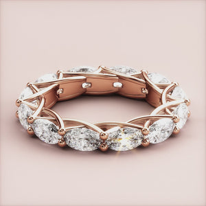 Elegant marquise diamond eternity wedding band in 14K or 18K rose gold, featuring a stunning line of diamonds in a sophisticated setting. 
