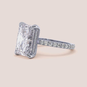 "14K white gold Leona radiant hidden halo ring with 3D pave design, perfect for elegant engagement moments.