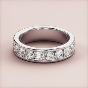 Elegant platinum or 14K/18K diamond eternity wedding band featuring round-cut diamonds in a channel setting, ideal for any occasion. 