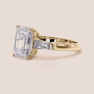 Elegant female hand displaying a yellow gold engagement ring with an emerald-cut diamond, perfect for a chic and stylish look. 