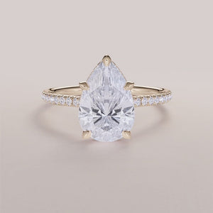 Elegant yellow gold engagement ring featuring a marquise diamond with aPave band, available in 14K, 18K, or platinum.