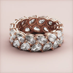 Luxurious 14K or 18K rose gold teardrop diamond eternity wedding band with two rows of expertly crafted diamonds. 