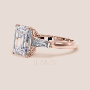 Elegant rose gold engagement ring showcasing a striking emerald-cut center diamond, flanked by baguette diamonds, exuding sophistication and modern style. 