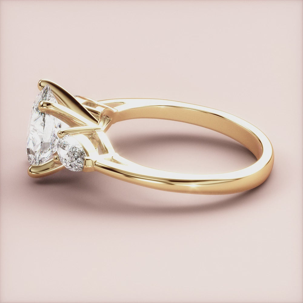 "14K Yellow Gold Titania Oval Three Stone Pear Engagement Ring - Elegant design perfect for timeless love.|




#14KRecycledYellowGold
#18KRecycledYellowGold





"
