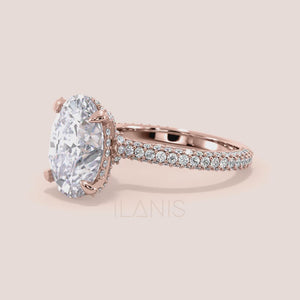 Oval diamond engagement ring in rose gold with hidden halo and pavé band, video showcasing 360 view, brilliance and sparkle from every angle 