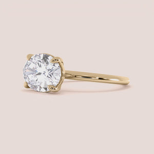 "14K Yellow Gold Daliah Oval East West Solitaire Engagement Ring, elegant design showcasing a stunning gemstone, perfect for weddings.