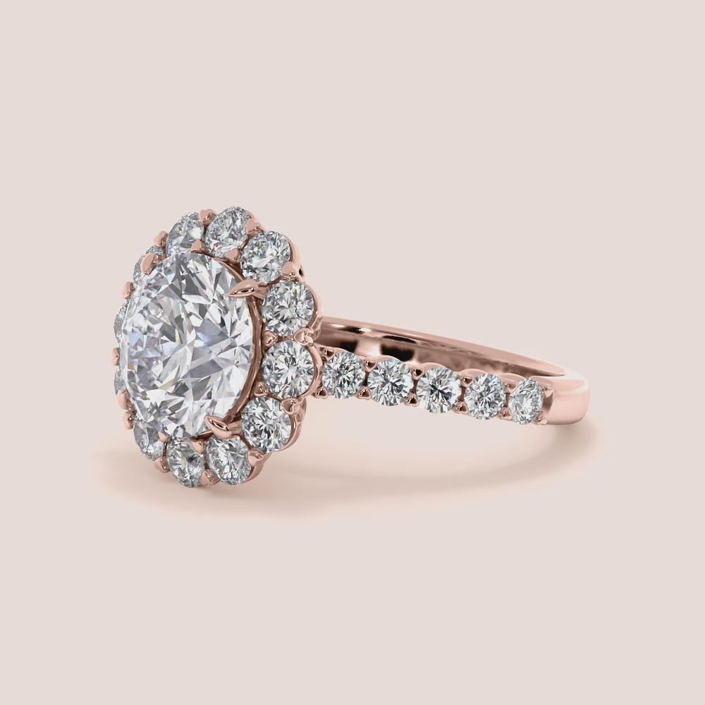 Exquisite halo engagement ring showcasing a round diamond in a stunning 14K or 18K gold or platinum band with smaller sparkling diamonds.
|


#14KRecycledRoseGold #18KRecycledRoseGold

