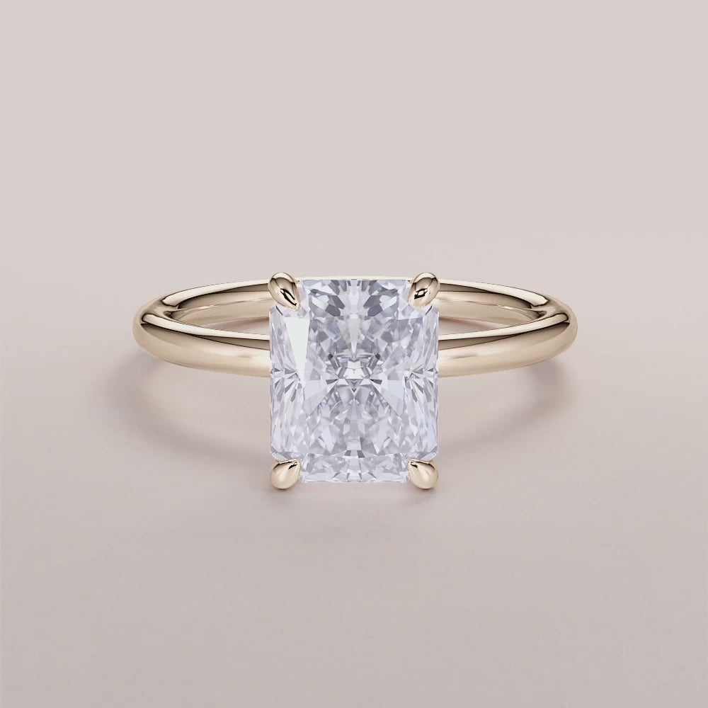 Elegant 14K/18K yellow gold solitaire engagement ring with marquise-cut diamond on a light background.|




#14KRecycledYellowGold
#18KRecycledYellowGold






