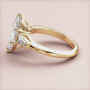 "Elegant 14K yellow gold marquise three-stone tapered baguette engagement ring, perfect for timeless love and commitment.