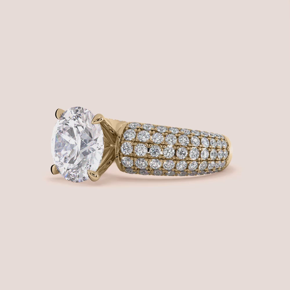 Luxurious round diamond ring in 14K or 18K gold or platinum, featuring an oval-cut diamond solitaire and smaller diamonds on the band.
|


#14KRecycledYellowGold #18KRecycledYellowGold 