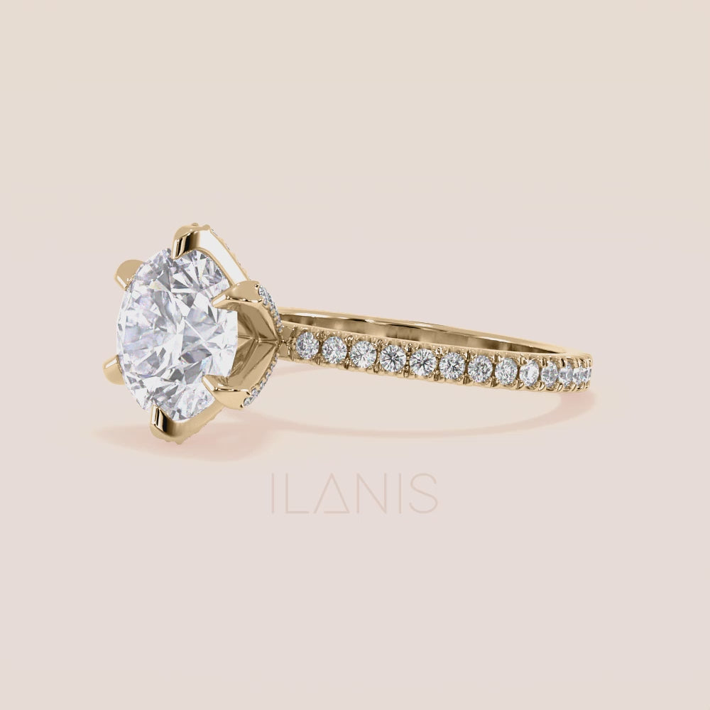 Close-up video of yellow gold round diamond engagement ring with pavé band, capturing brilliance, light reflection and accent diamond prongs in motion | #14KRecycledYellowGold #18KRecycledYellowGold