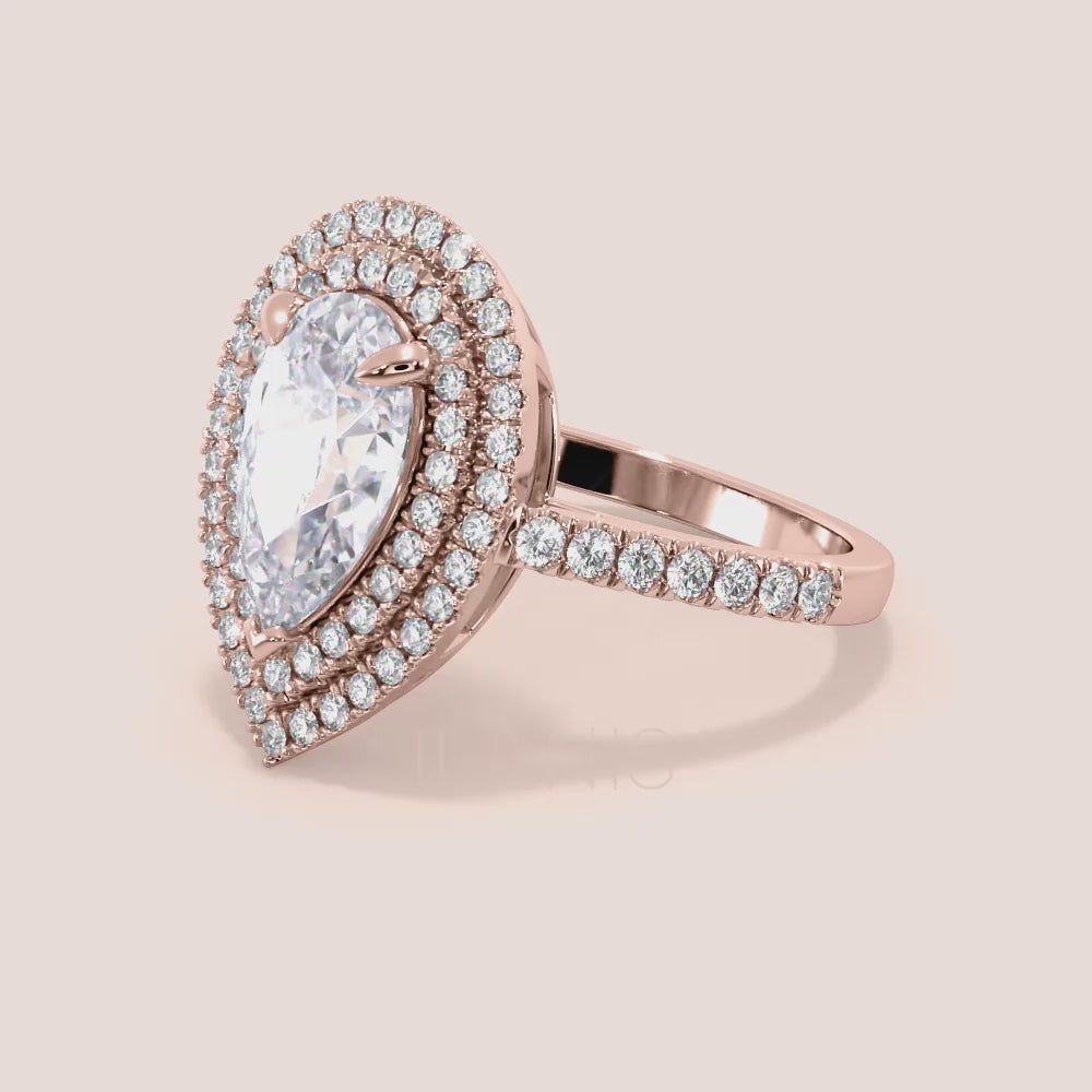 Pear diamond engagement ring rose gold worn on hand, double halo setting with pavé band, timeless romantic look | #14KRecycledRoseGold #18KRecycledRoseGold