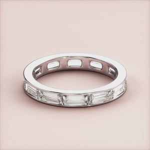 Elegant 14K or 18K gold eternity band featuring baguette-cut diamonds.  Perfect for weddings or daily wear. 